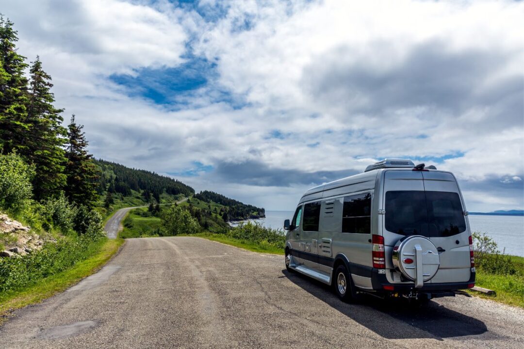 silver sprinter van on a road