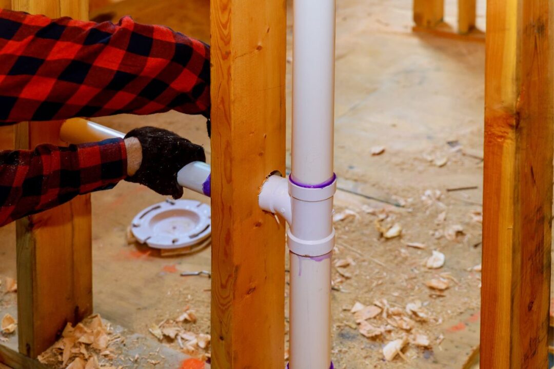 plumbing being installed in a wall